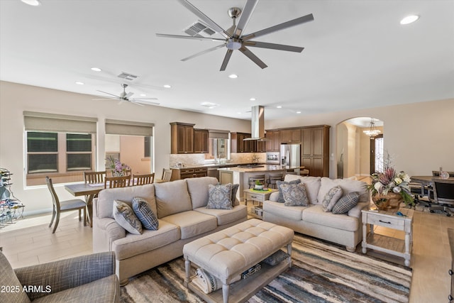 644 E Las Puertas Ln, Queen Creek, AZ 85140 - living area featuring recessed lighting, arched walkways, visible vents, and ceiling fan