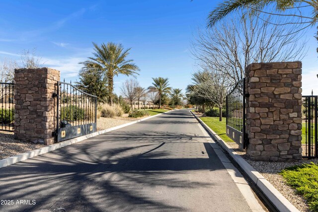 644 E Las Puertas Ln, Queen Creek, AZ 85140 - view of street featuring curbs and a gate