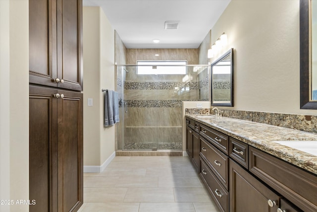 644 E Las Puertas Ln, Queen Creek, AZ 85140 - full bathroom featuring a sink, visible vents, double vanity, and a stall shower