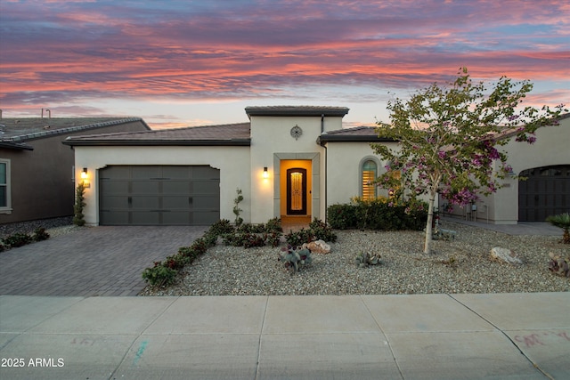 644 E Las Puertas Ln, Queen Creek, AZ 85140 - view of front facade featuring stucco siding, a tiled roof, decorative driveway, and an attached garage