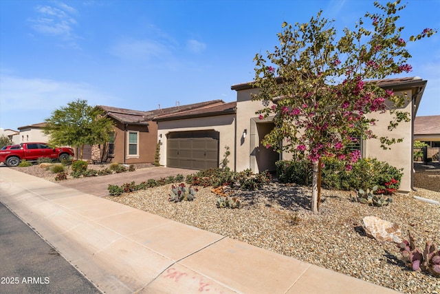 644 E Las Puertas Ln, Queen Creek, AZ 85140 - view of front of property with driveway, stucco siding, and an attached garage