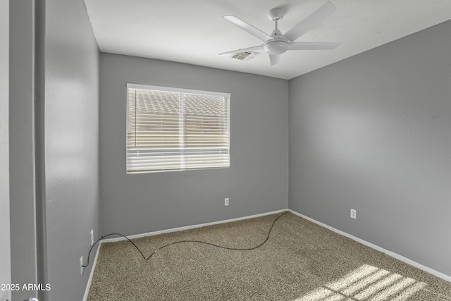 unfurnished room with visible vents, baseboards, a ceiling fan, and carpet floors