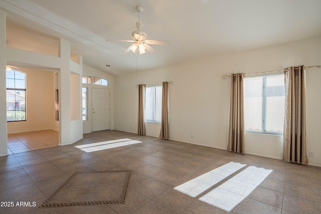 empty room with tile patterned flooring, lofted ceiling, and ceiling fan