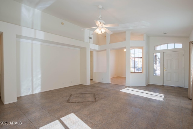 foyer featuring tile patterned floors, high vaulted ceiling, and ceiling fan