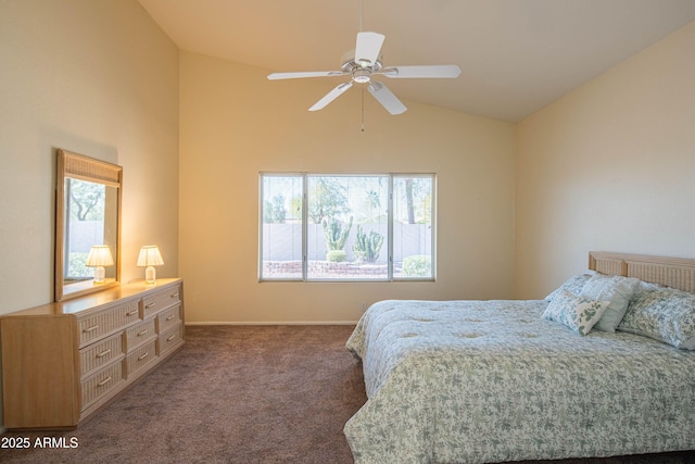 bedroom with lofted ceiling, dark carpet, and ceiling fan