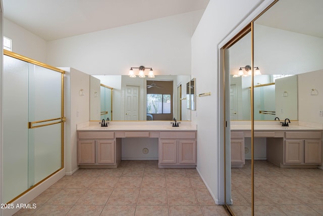 bathroom featuring tile patterned floors, vanity, and an enclosed shower