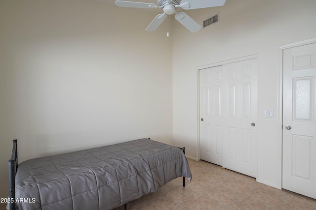 bedroom with light tile patterned flooring and ceiling fan