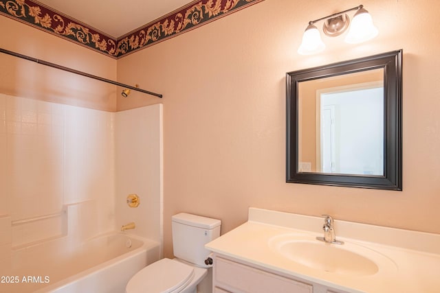 full bathroom featuring bathing tub / shower combination, vanity, and toilet