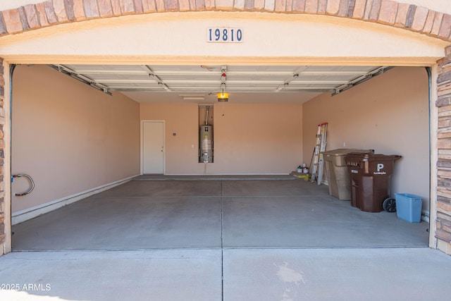 garage with a garage door opener and gas water heater