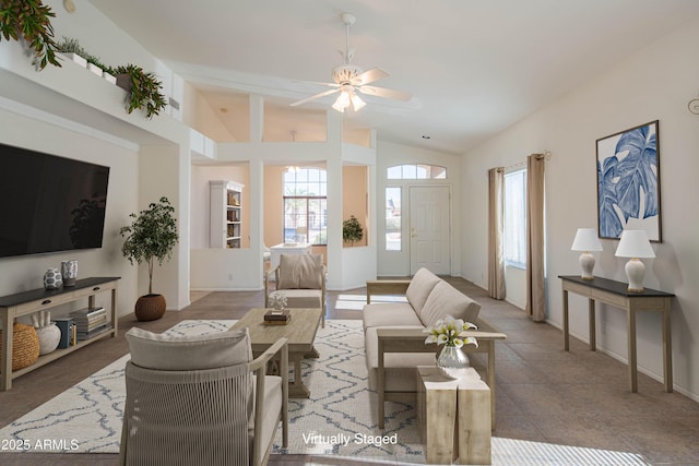 living room with ceiling fan, lofted ceiling, and a wealth of natural light