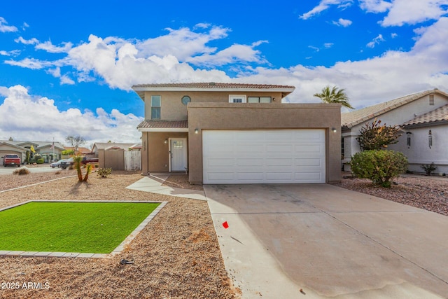 2079 N Sweetwater Dr, Casa Grande, AZ 85122 - view of front facade featuring stucco siding, a garage, driveway, and a tiled roof
