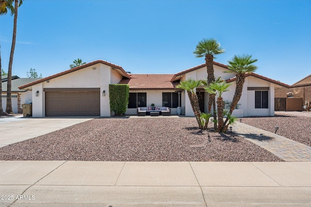 5415 E Juniper Ave, Scottsdale, AZ 85254 - view of front of home with driveway, a garage, an outdoor hangout area, stucco siding, and a tiled roof