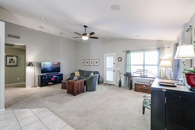 carpeted living room featuring ceiling fan and lofted ceiling