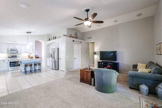 living room with high vaulted ceiling, light tile patterned floors, and ceiling fan