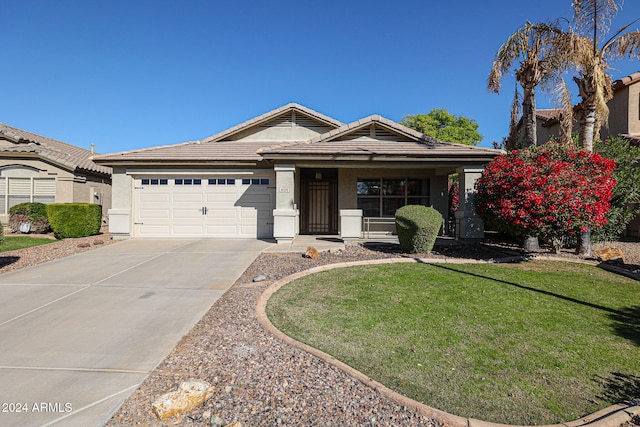 view of front of house featuring a garage and a front yard