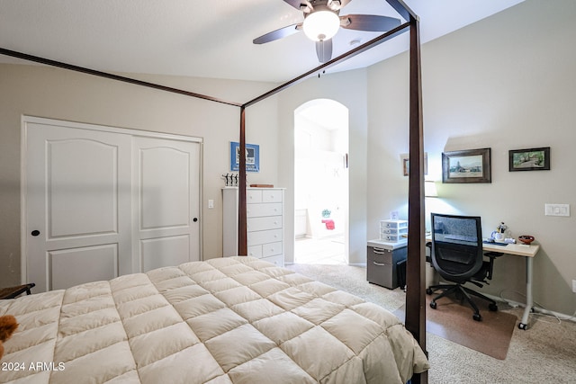 carpeted bedroom featuring lofted ceiling, ceiling fan, and a closet