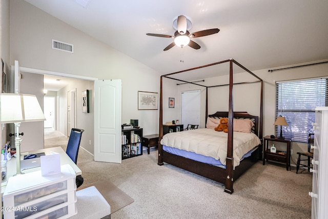 bedroom featuring light carpet, ceiling fan, and vaulted ceiling