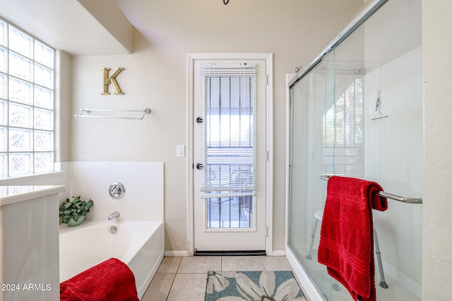 bathroom featuring independent shower and bath and tile patterned flooring