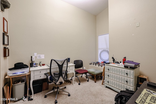 carpeted office with lofted ceiling