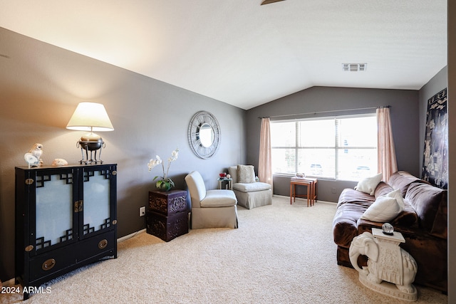 living room featuring carpet and lofted ceiling