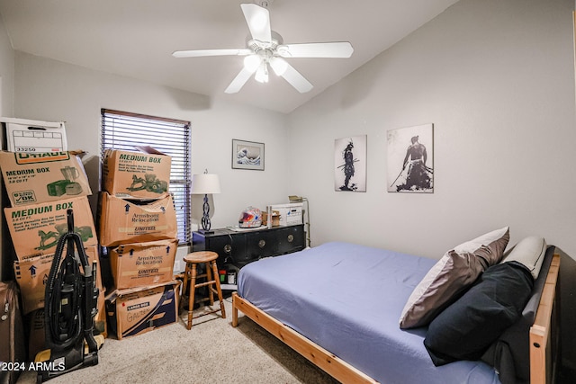 carpeted bedroom featuring ceiling fan and vaulted ceiling