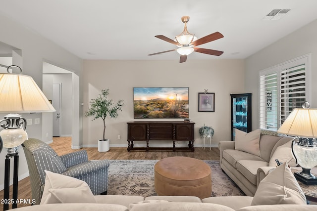 27276 N 81st Ln, Peoria, AZ 85383 - living room with a ceiling fan, wood finished floors, and baseboards