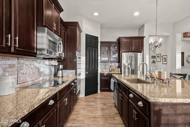 27276 N 81st Ln, Peoria, AZ 85383 - kitchen featuring appliances with stainless steel finishes, a chandelier, a center island with sink, a sink, and pendant lighting