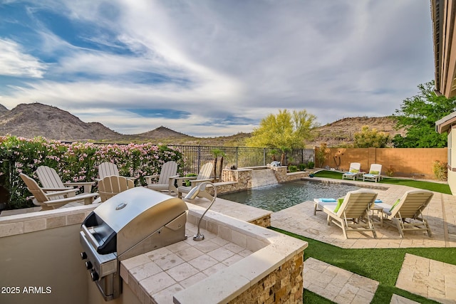 27276 N 81st Ln, Peoria, AZ 85383 - view of patio / terrace with a fenced backyard, a mountain view, a grill, and area for grilling