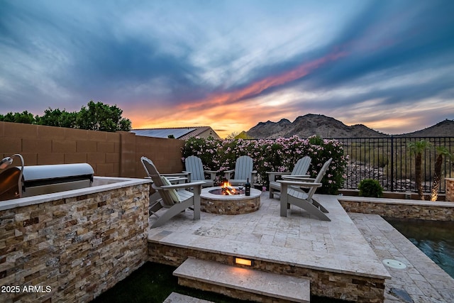 27276 N 81st Ln, Peoria, AZ 85383 - view of patio featuring an outdoor fire pit and a mountain view