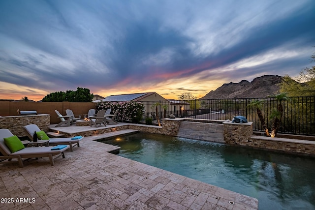 27276 N 81st Ln, Peoria, AZ 85383 - view of swimming pool with a fire pit, a patio area, a fenced backyard, a mountain view, and area for grilling