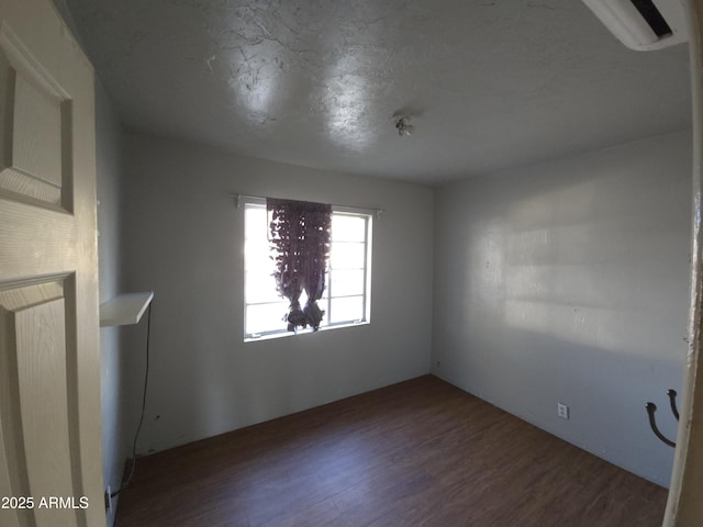 empty room with dark wood-type flooring