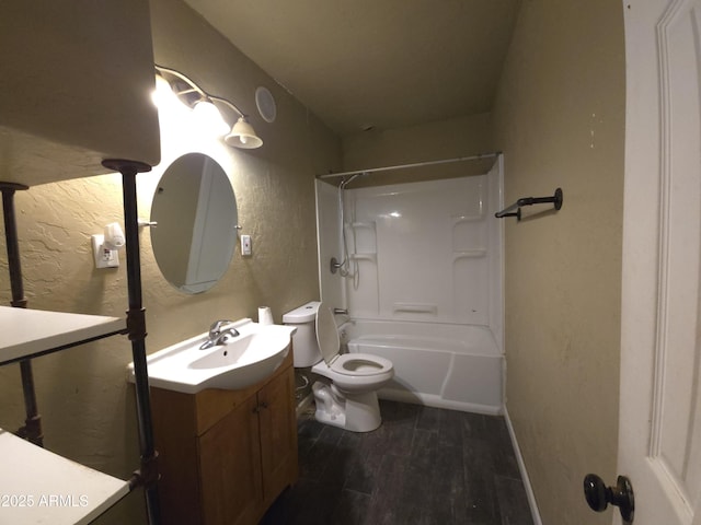 full bathroom with vanity, hardwood / wood-style flooring, toilet, and shower / washtub combination