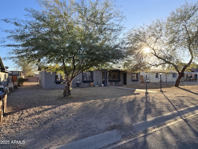 view of property hidden behind natural elements