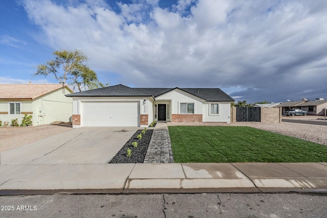 ranch-style home featuring a garage and a front lawn