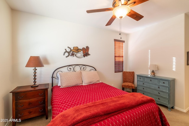 bedroom featuring a ceiling fan, carpet, and baseboards