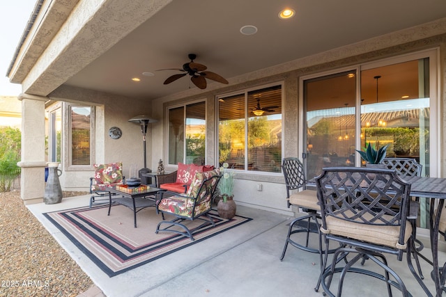 view of patio / terrace with outdoor dining space and ceiling fan