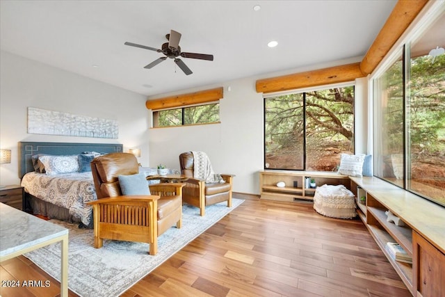 bedroom with ceiling fan and light wood-type flooring