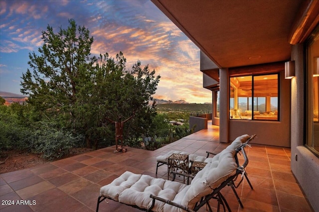 view of patio terrace at dusk