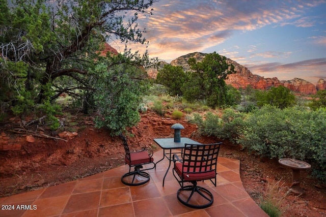 patio terrace at dusk with a mountain view