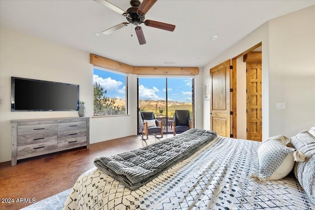 bedroom featuring access to outside, ceiling fan, and dark colored carpet