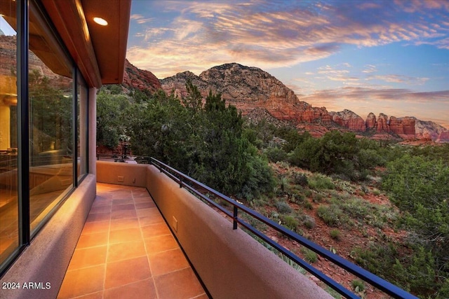 balcony at dusk with a mountain view