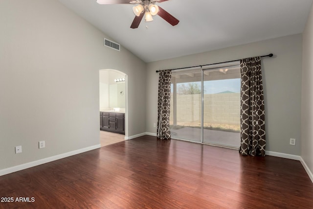 9002 W Caribbean Ln, Peoria, AZ 85381 - unfurnished room featuring ceiling fan, arched walkways, wood finished floors, baseboards, and high vaulted ceiling