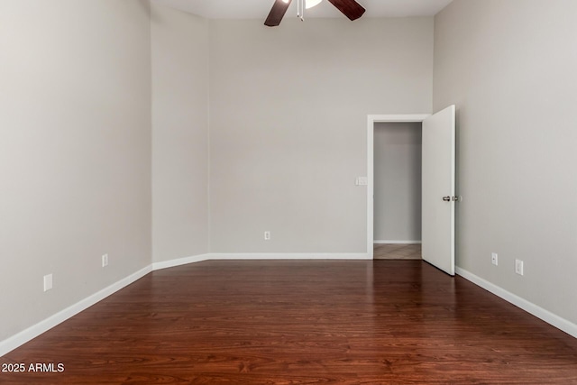 9002 W Caribbean Ln, Peoria, AZ 85381 - empty room featuring a ceiling fan, wood finished floors, and baseboards