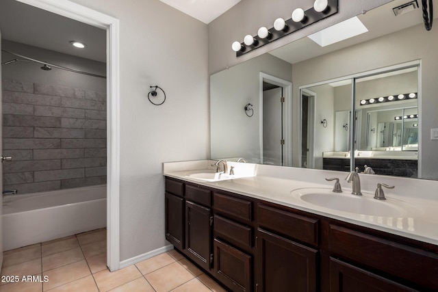 9002 W Caribbean Ln, Peoria, AZ 85381 - full bath featuring tile patterned flooring, double vanity, a skylight, and shower / tub combination