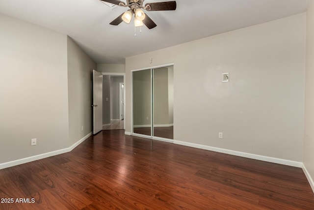 9002 W Caribbean Ln, Peoria, AZ 85381 - unfurnished bedroom with baseboards, wood finished floors, a closet, and a ceiling fan