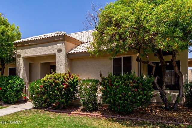 9002 W Caribbean Ln, Peoria, AZ 85381 - view of front facade featuring stucco siding and a tile roof