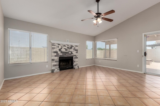 9002 W Caribbean Ln, Peoria, AZ 85381 - unfurnished living room with ceiling fan, a stone fireplace, baseboards, and high vaulted ceiling