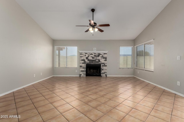 9002 W Caribbean Ln, Peoria, AZ 85381 - unfurnished living room featuring a ceiling fan, vaulted ceiling, a fireplace, light tile patterned floors, and baseboards