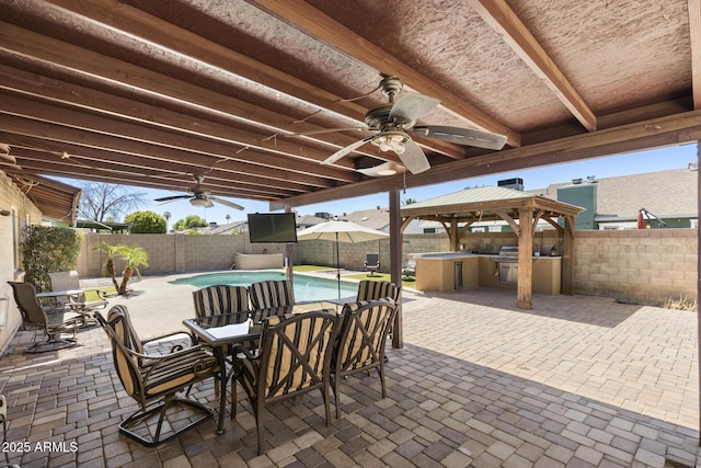 6605 W Altadena Ave, Glendale, AZ 85304 - fenced backyard with a gazebo, exterior kitchen, ceiling fan, a patio, and outdoor dining area