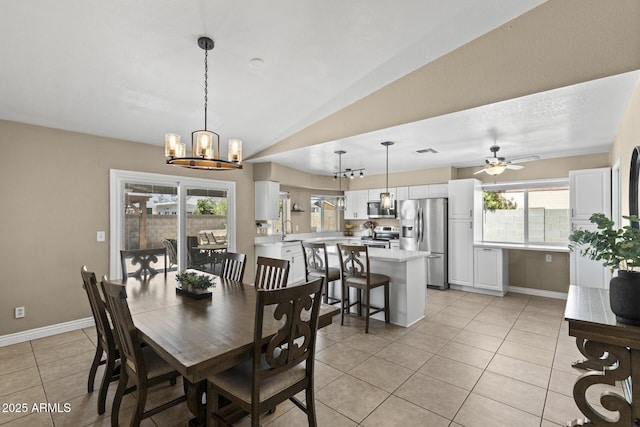 6605 W Altadena Ave, Glendale, AZ 85304 - dining room with light tile patterned flooring, healthy amount of natural light, a chandelier, lofted ceiling, and a ceiling fan